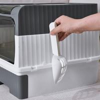 Cat litter scoop storage on the right—easier to access.