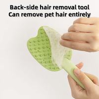 Green pet hair removal comb showing collected loose pet fur
