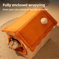 Fully enclosed orange bear-shaped plush cat house with a cat peeking out, cozy warm pet bed.