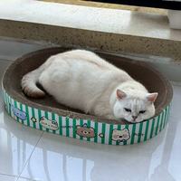 Oval corrugated cat scratching board with cute cartoon print for cat rest and scratch